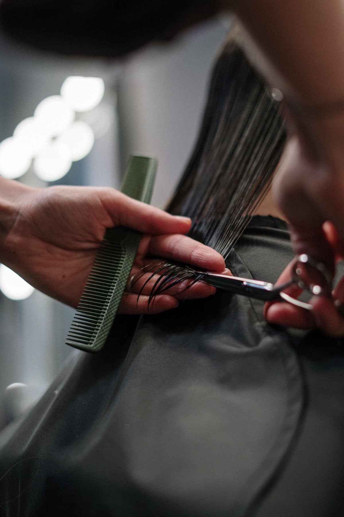 A precision cut being shaped with comb and scissors